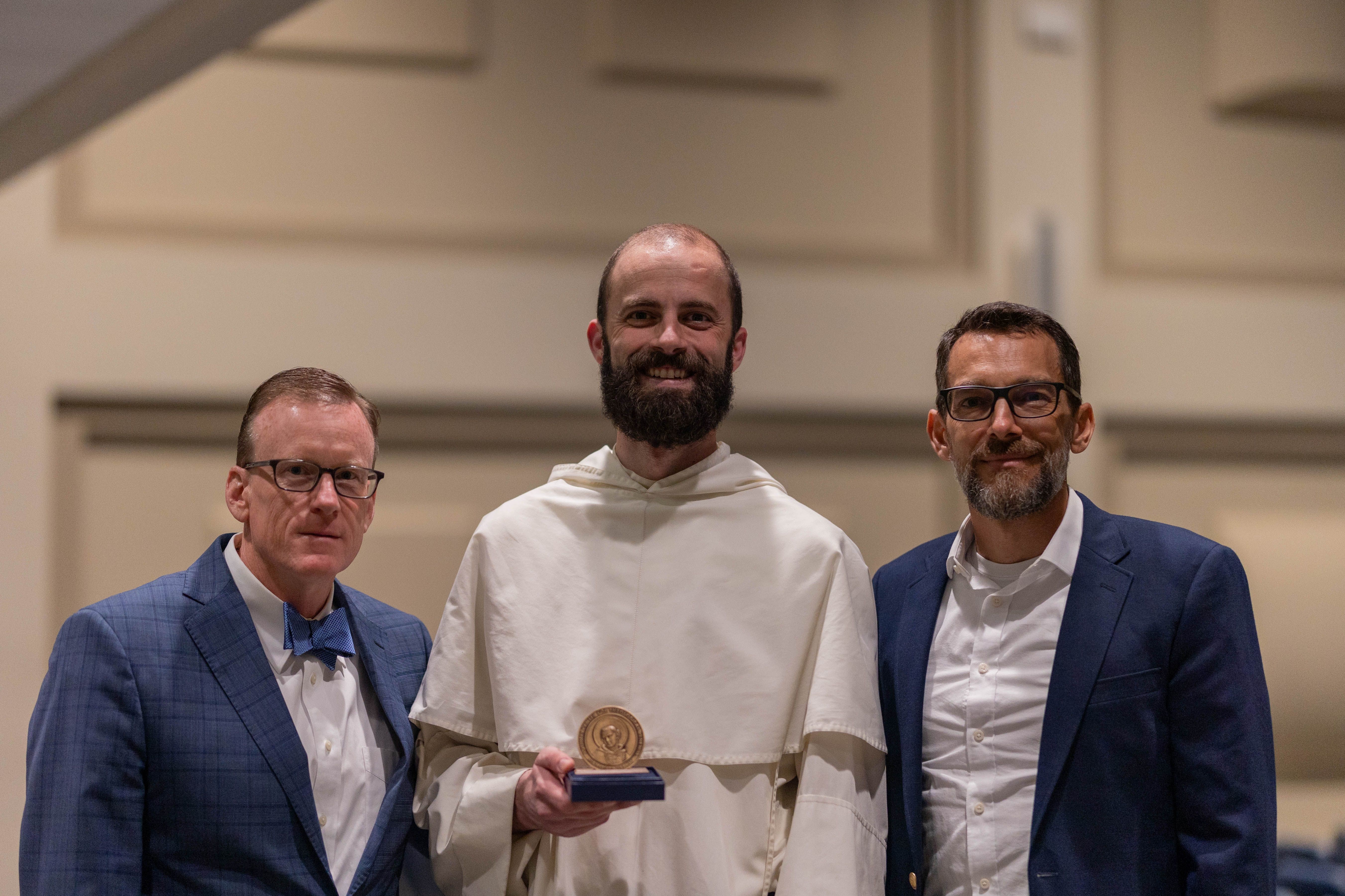 Fr. Pine Receiving Dissertation Award